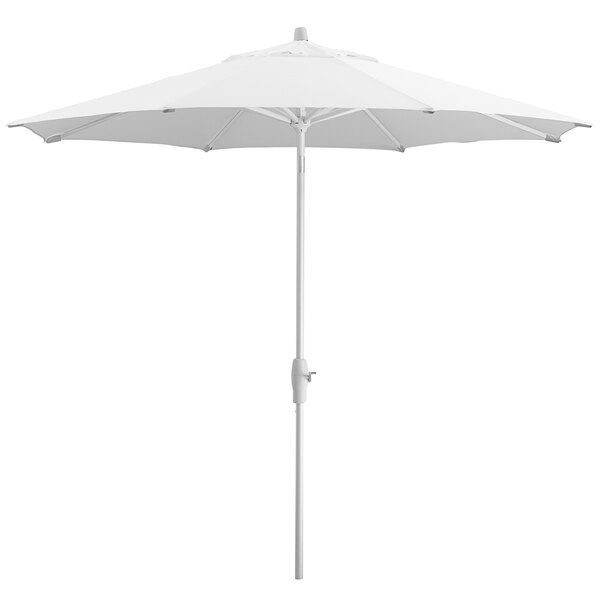 A white Lancaster Table & Seating umbrella with a pole.