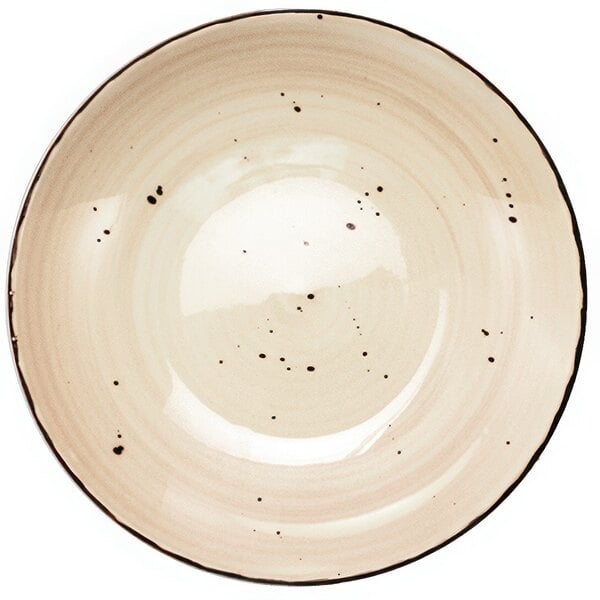 A close-up of a white porcelain pasta bowl with brown speckles.