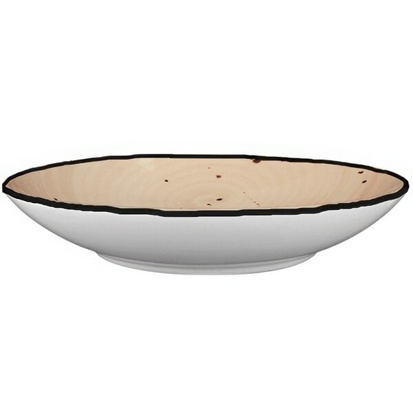 An International Tableware wheat porcelain pasta bowl with a black border.