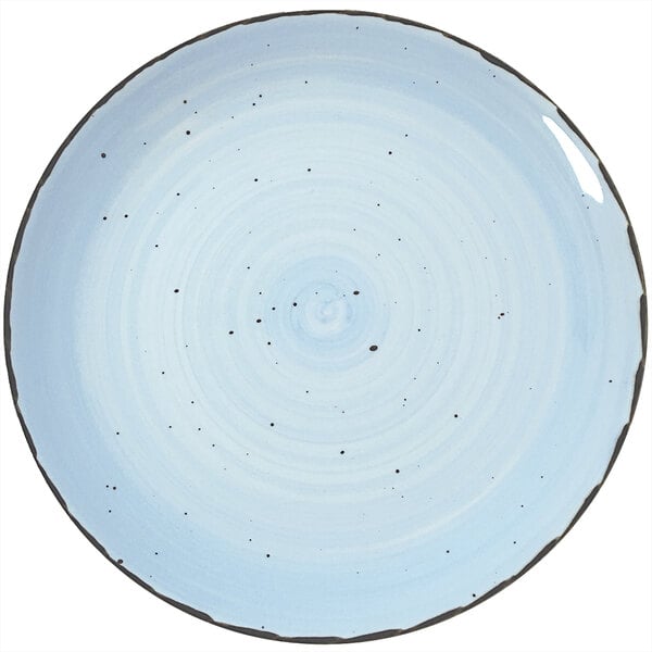 A close up of a blue and white speckled International Tableware Rotana Iceburg coupe porcelain plate.