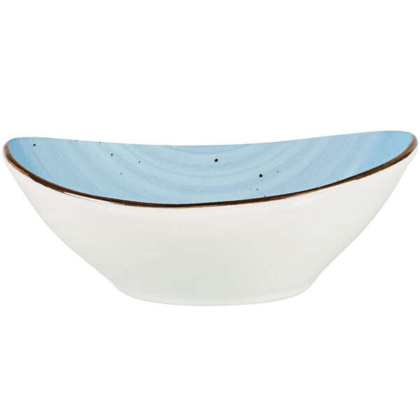 An International Tableware Iceburg porcelain bowl with a blue rim.