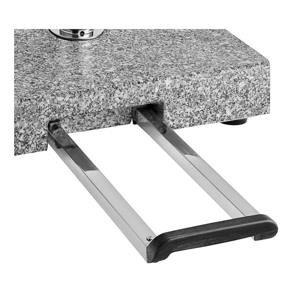A gray granite square umbrella base with a metal handle.