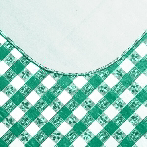 A green and white checkered Choice vinyl table cover with a flannel back.