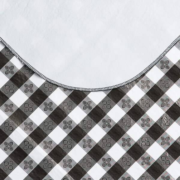 A black and white checkered Choice vinyl table cover with a flannel back.
