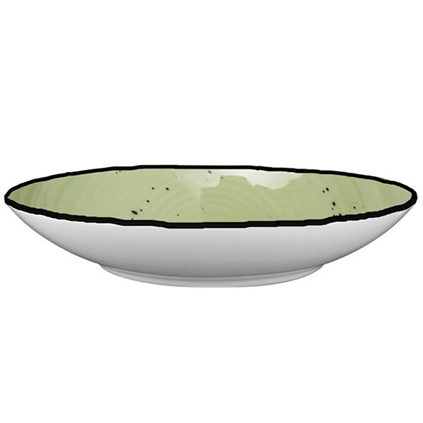 A close up of a lime green International Tableware Rotana pasta bowl with a rim.