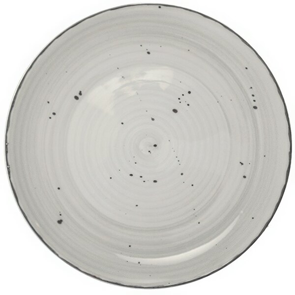 A close-up of an International Tableware stone porcelain pasta bowl with black specks.