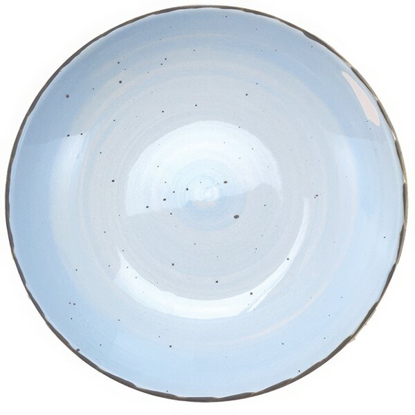 A white porcelain pasta bowl with a blue speckled design.