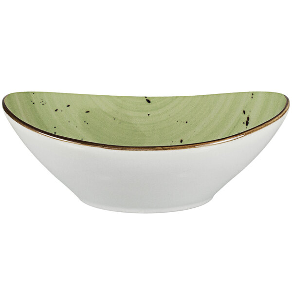 a white bowl with a green rim