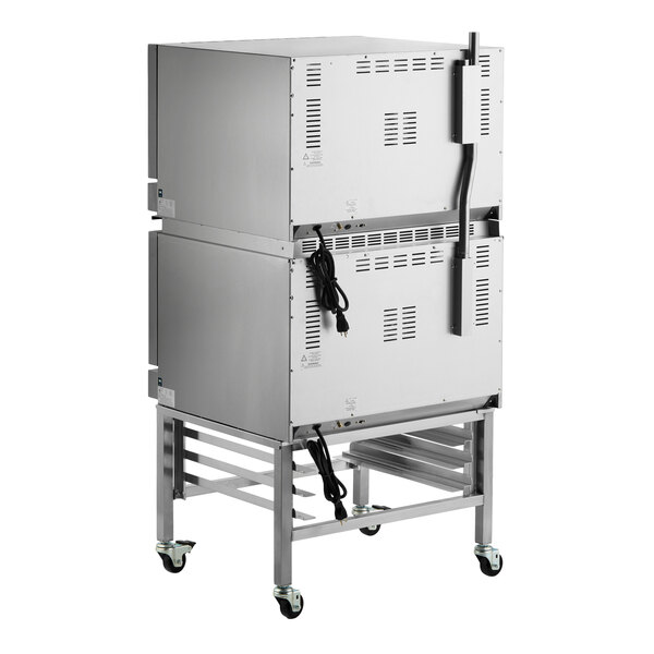 A double deck full size electric convection oven with mechanical controls and casters.