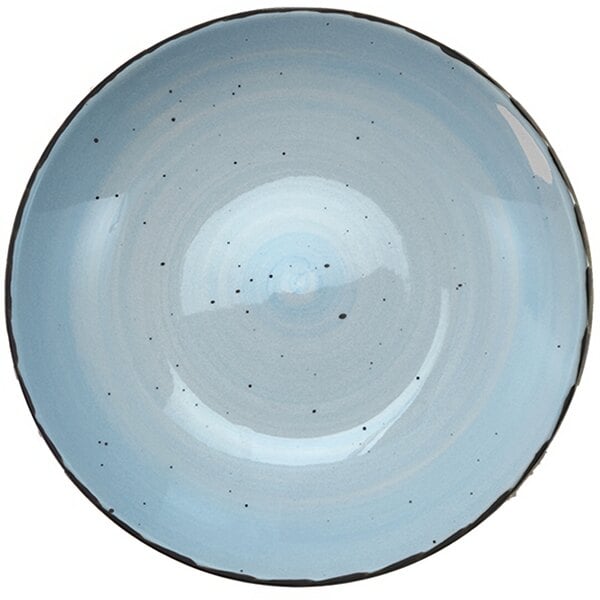 A white pasta bowl with blue specks on it.