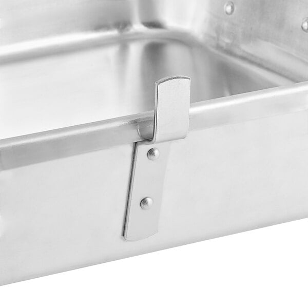 A Choice aluminum double roaster pan on a counter.