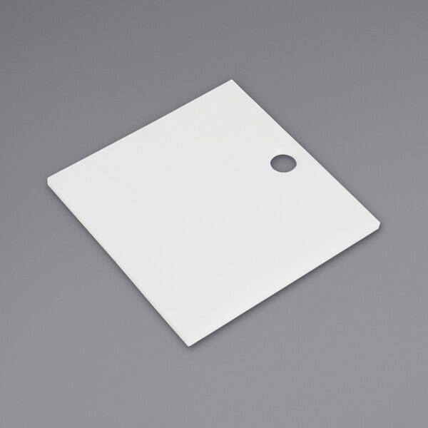 a white square object with a hole