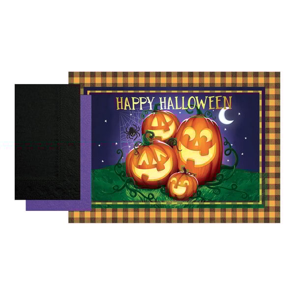 A close up of a Hoffmaster Halloween placemat with a pumpkin with a face carved into it.