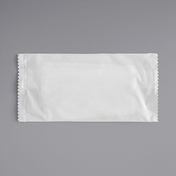 A white package of Fresh Towel moist towelettes.