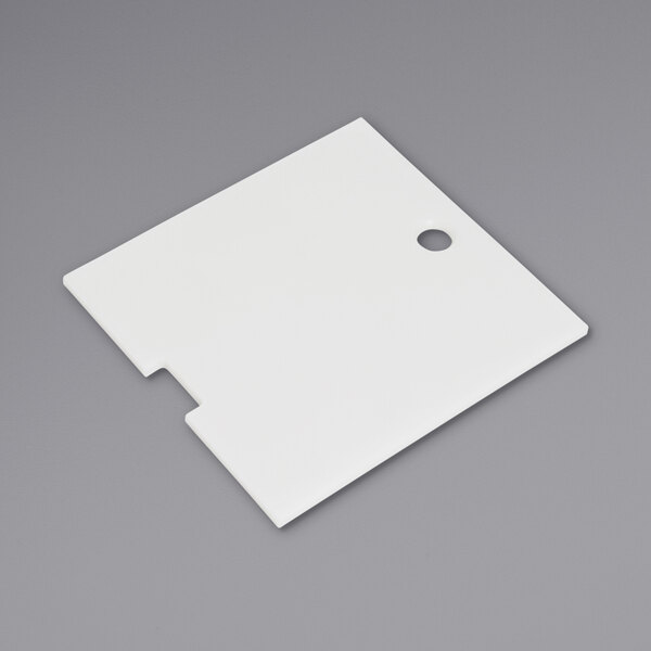 a white square object with a hole