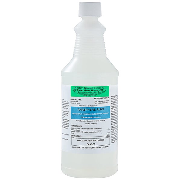 A white bottle of Eastern Tabletop Go Clean Germbuster Disinfectant with a green label on a counter.