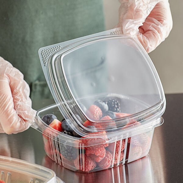 plastic containers with fruit in them