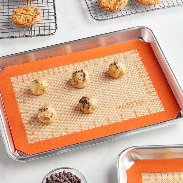 A tray of cookies on a Baker's Lane quarter size baking mat.