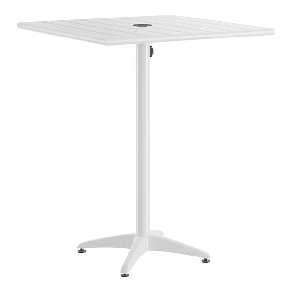 A white, square, bar-height outdoor table with a central umbrella hole and a four-legged base.