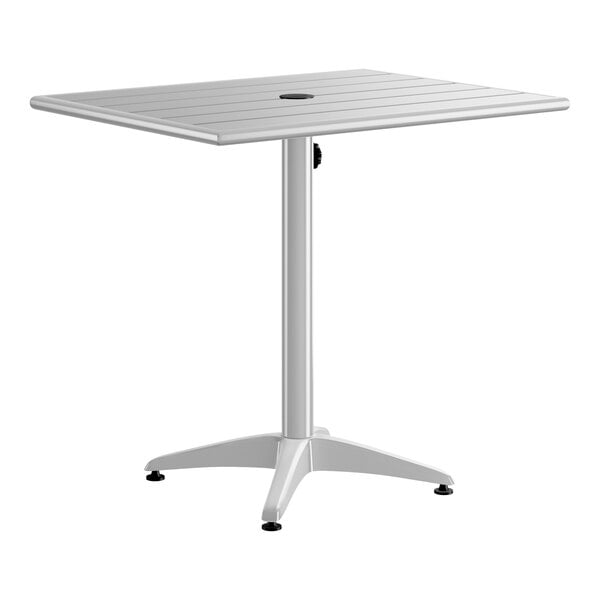 A rectangular silver aluminum outdoor dining table with an umbrella hole in the center.