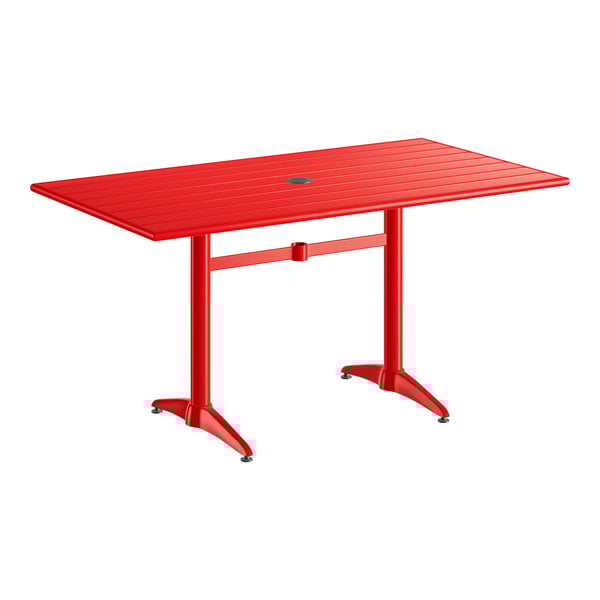 A rectangular red powder-coated aluminum outdoor dining table with an umbrella hole in the center.