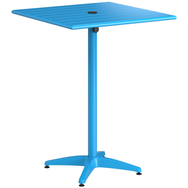 A blue square Lancaster Table & Seating bar height table with a metal base and umbrella hole.