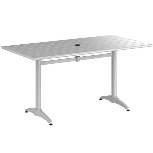 A white table with a silver metal base and legs.