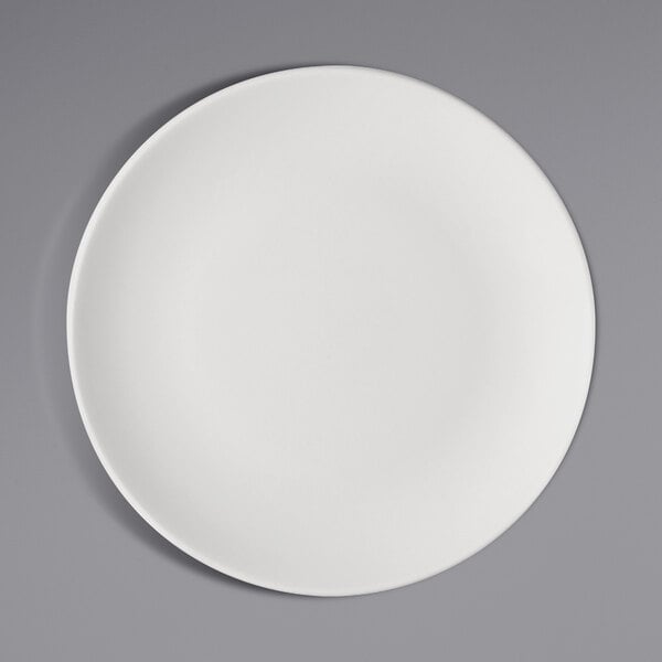 A Bauscher bright white porcelain plate with a circular pattern on the rim.