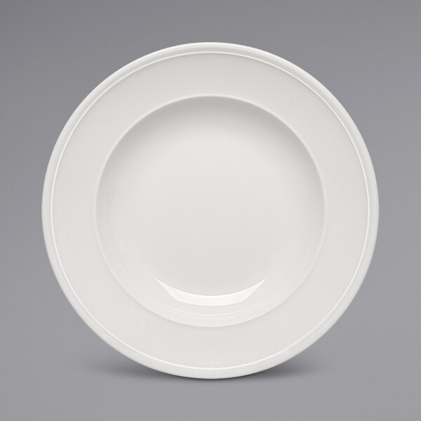 A Bauscher bright white porcelain plate with a wide rim.