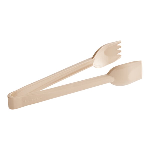 A pair of Carlisle beige plastic salad tongs.
