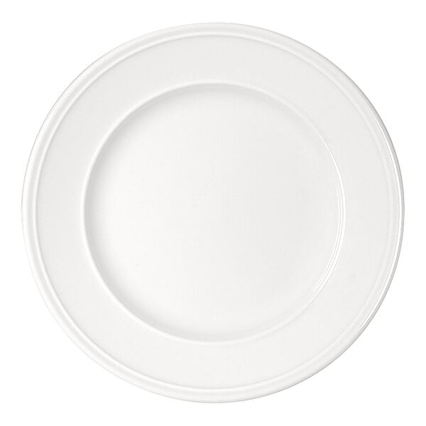 A plain, round, white plate with a wide rim and a smooth surface.