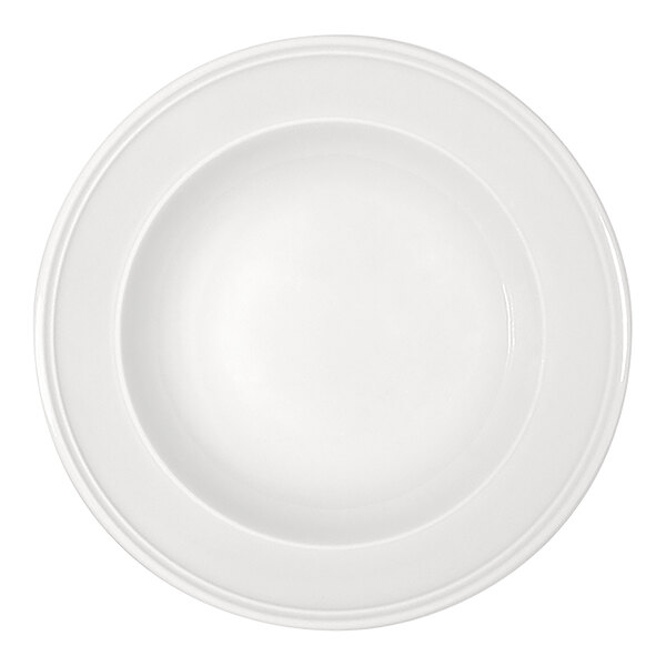 A round, bright white plate with a wide rim and a deep center, viewed from above.