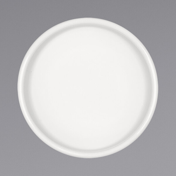 A Bauscher bright white round porcelain sauce dish.