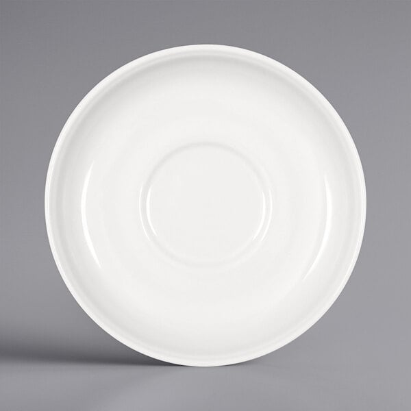 A Bauscher bright white porcelain saucer with a circular design.