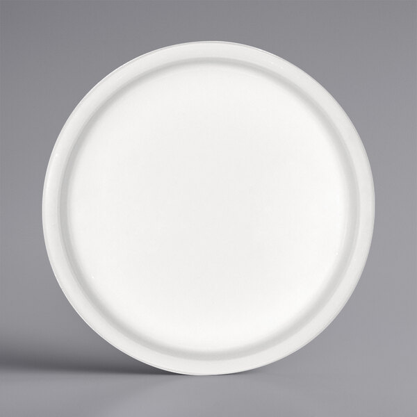 A Bauscher bright white porcelain sauce dish with a white border.