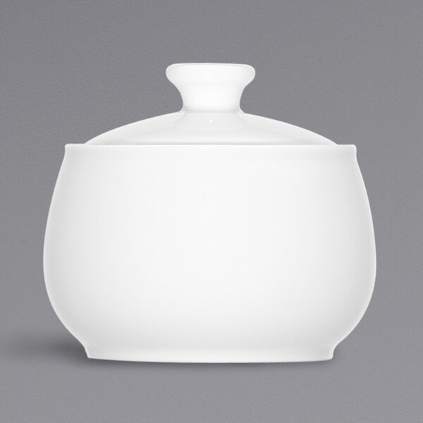 A Bauscher bright white porcelain sugar bowl with a lid.