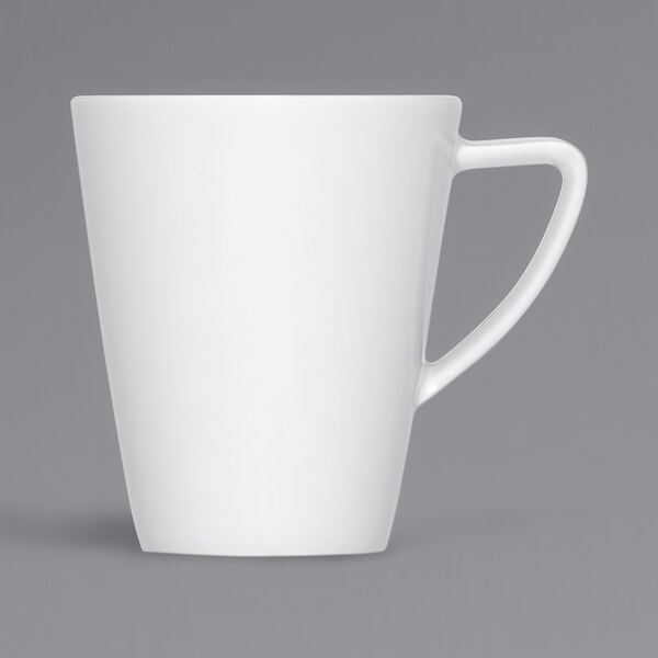A close up of a Bauscher bright white porcelain cup with a handle.