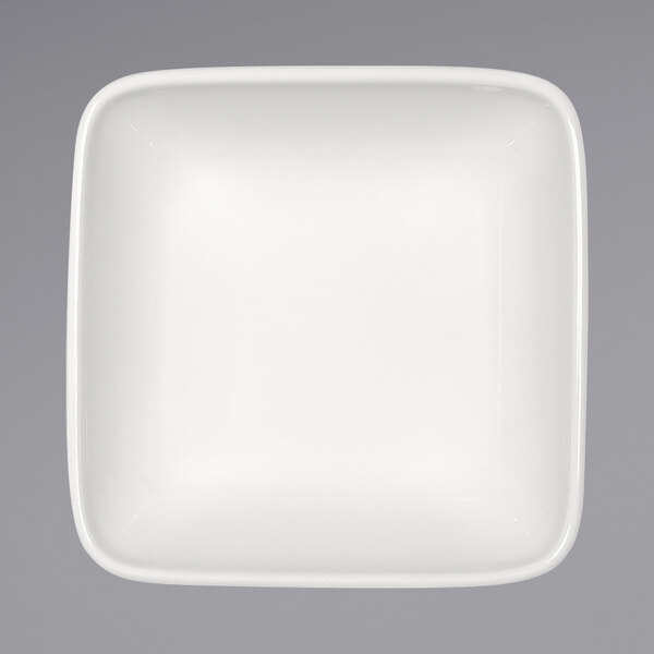 A white square bowl with a white rim.