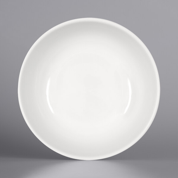 A Bauscher bright white porcelain dish with a circular pattern on the rim.