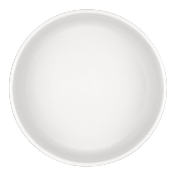 A top-down view of a plain, round, white bowl.