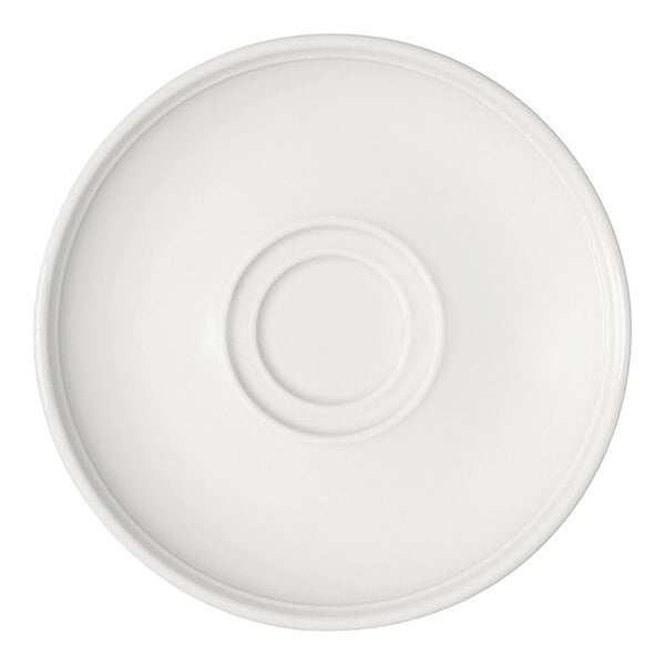 A round, bright white saucer with a raised circular indentation in the center, viewed from above.
