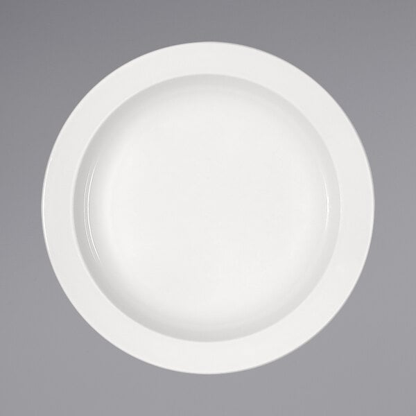 A Bauscher bright white porcelain deep coupe plate with a white rim on a gray background.