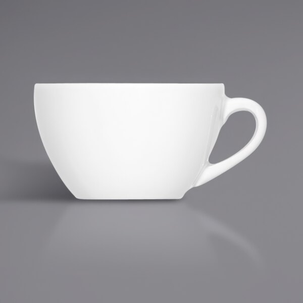 A Bauscher bright white porcelain cup with a handle.