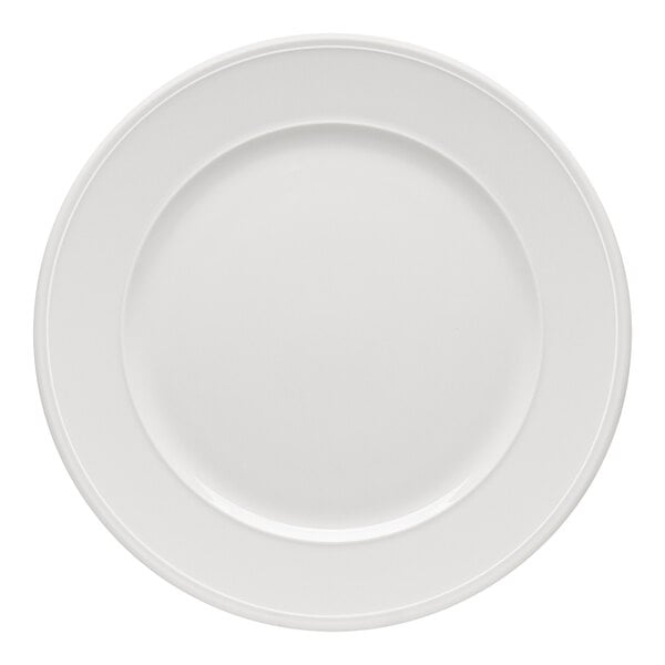 A plain, round, white plate with a wide rim viewed from above.
