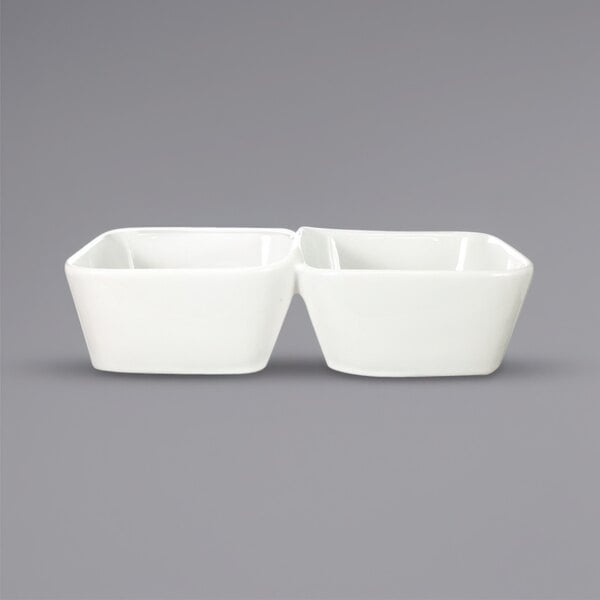 Two International Tableware white porcelain 2-compartment bowls.