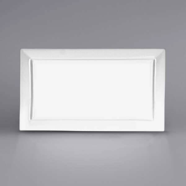 A white rectangular porcelain platter with a black border.