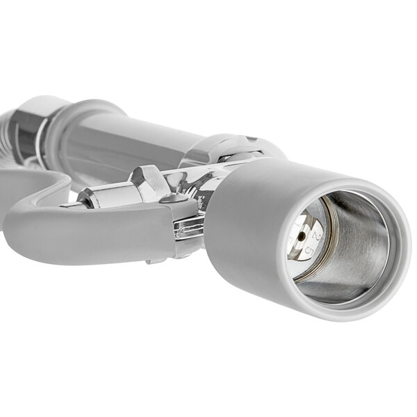 A silver pre-rinse spray valve with a white handle.