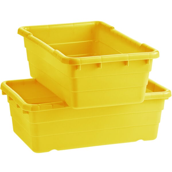 A stack of yellow Choice meat lug tote boxes.