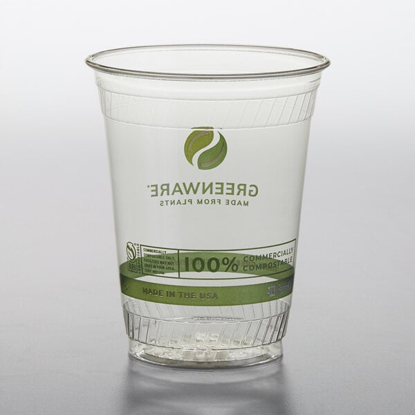 A clear plastic Fabri-Kal Greenware cup with a green label.