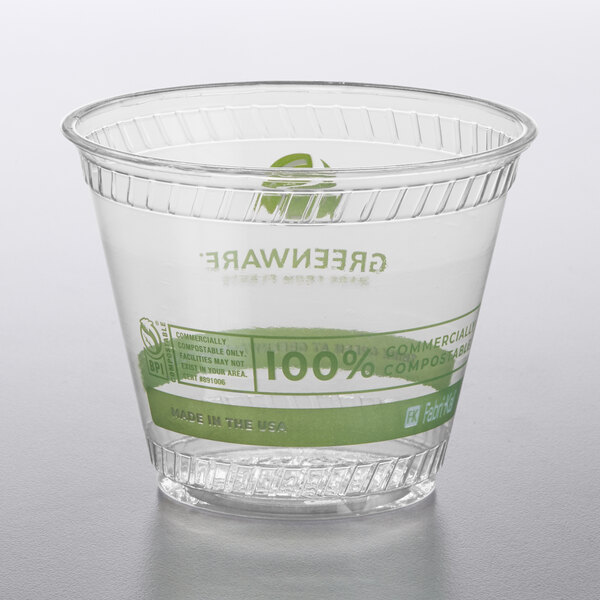 A clear plastic Fabri-Kal Greenware cup with a green label.